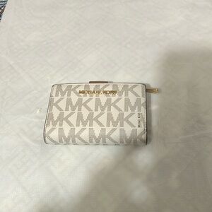 Gently used Michael Kors cream logo wallet.